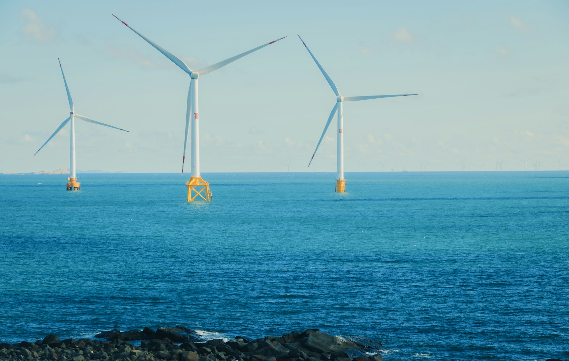 Offshore wind turbines in the ocean on a clear day