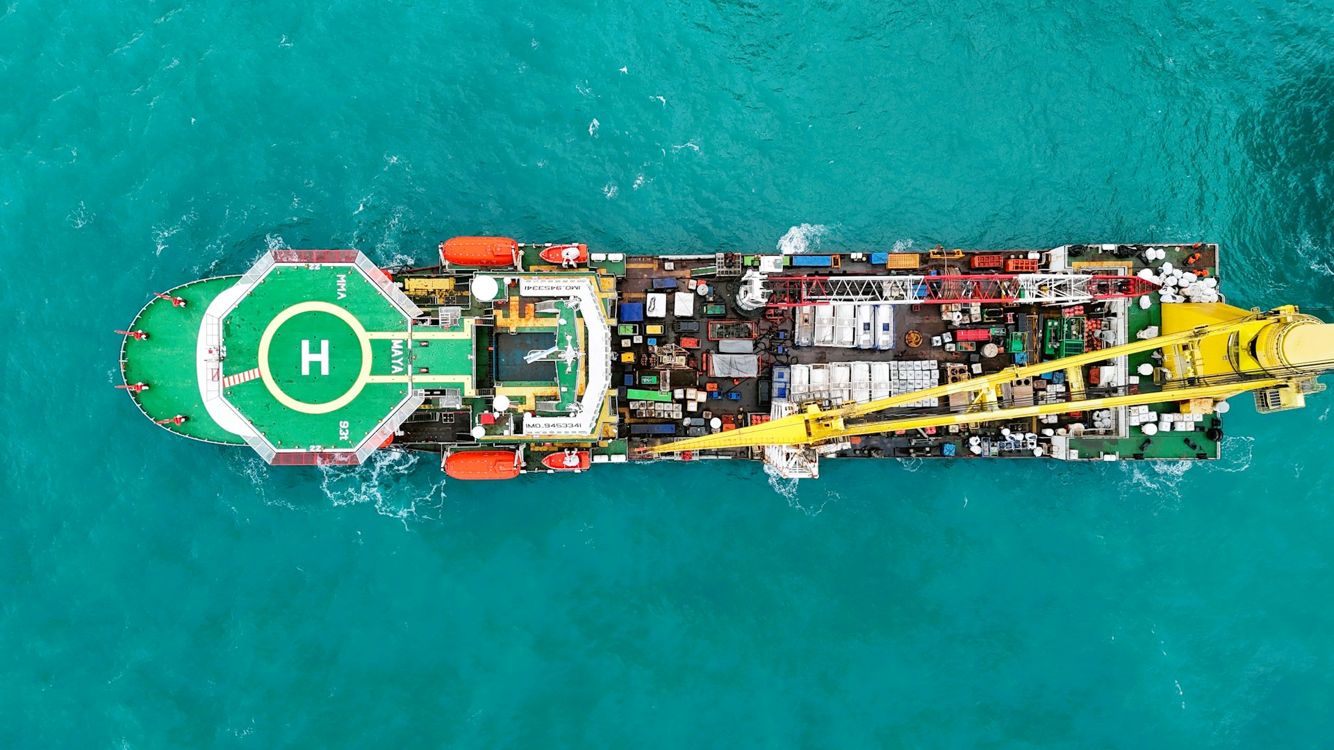 Industrial offshore vessel with helipad at sea