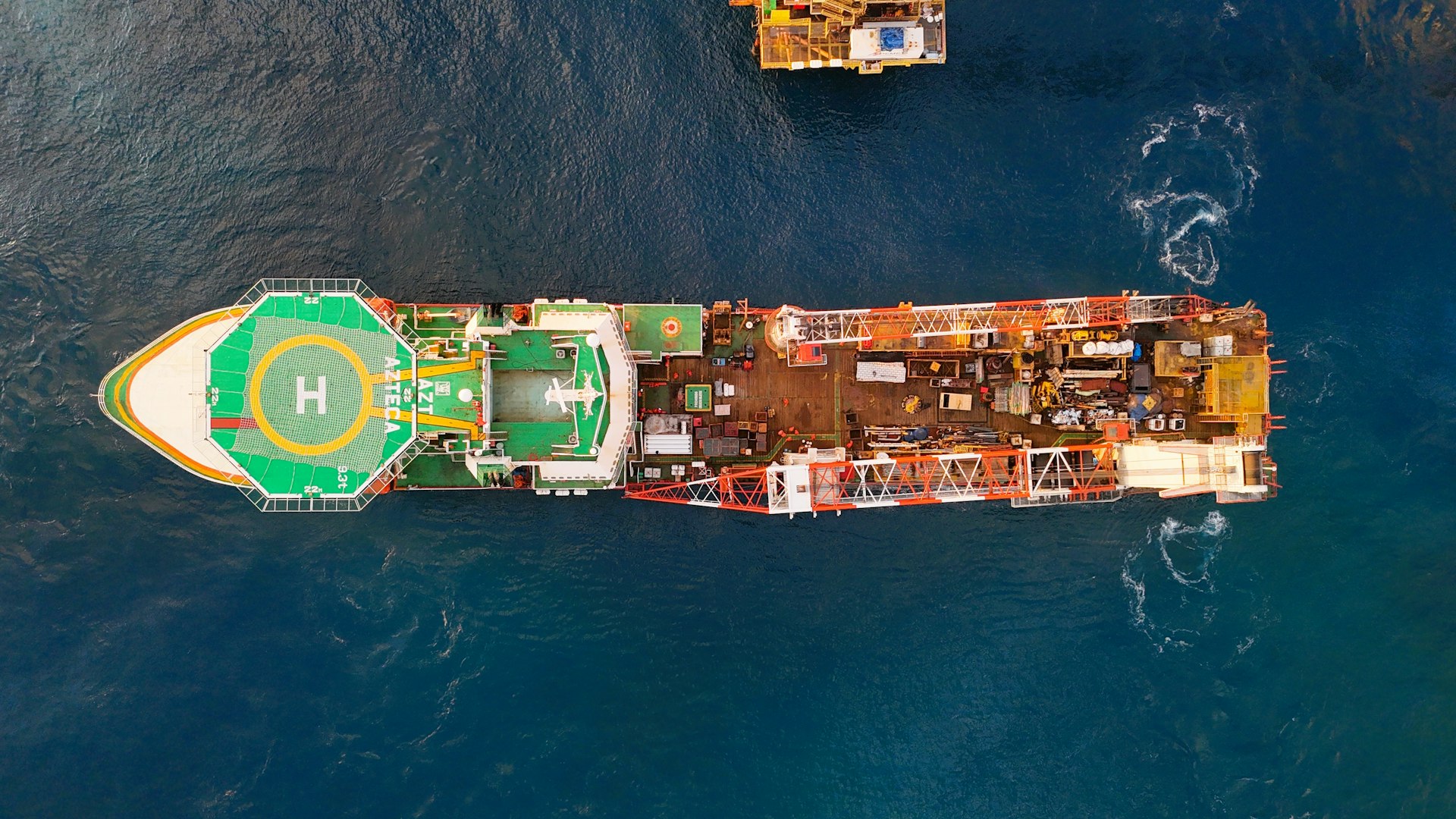 Aerial view of a large offshore construction vessel at sea